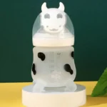 شیشه شیر سیلیکونی یوگی بی بی طرح گاو 180 میل - تصویر 2